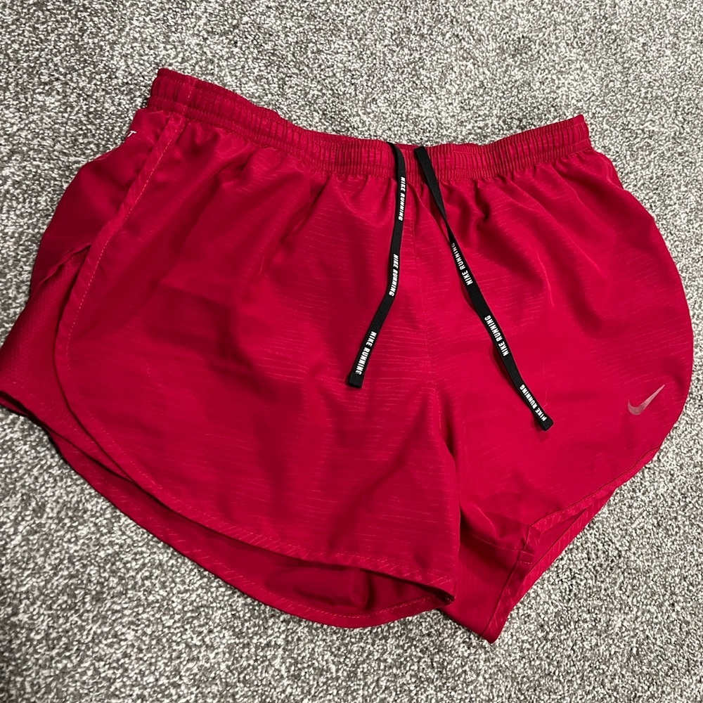 Red Nike running shorts